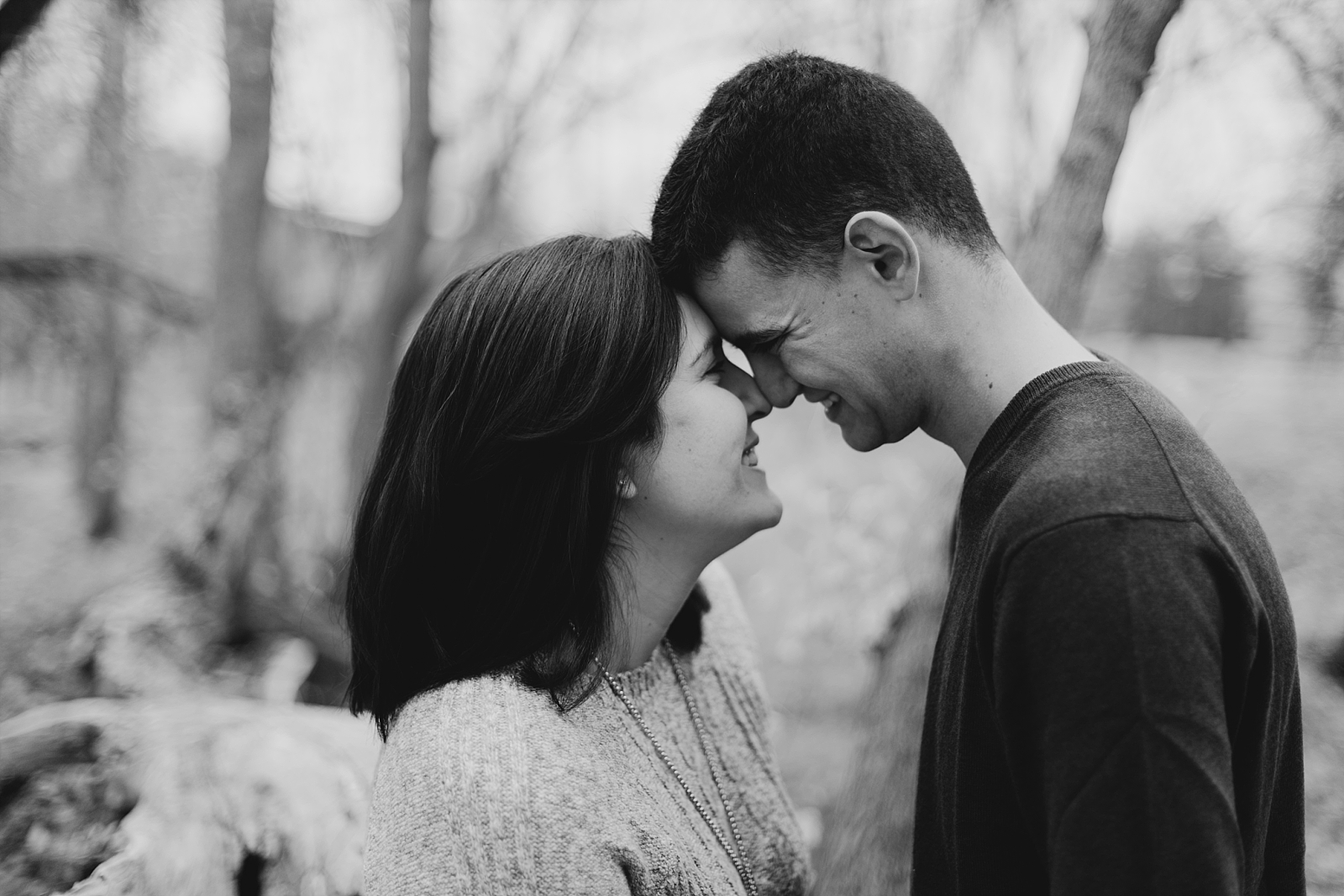 Romantic playful adventurous fall leaves forest black and white engagement photo session in prescott arizona samantha patri photography
