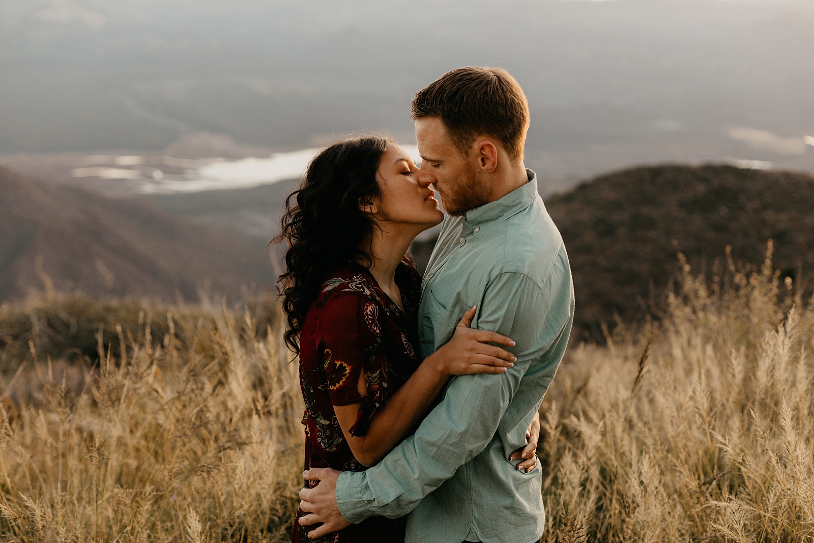 couple kissing on a mountaintop at sunrise Humboldt Mountain engagement photos Scottsdale az Samantha Patri Photography