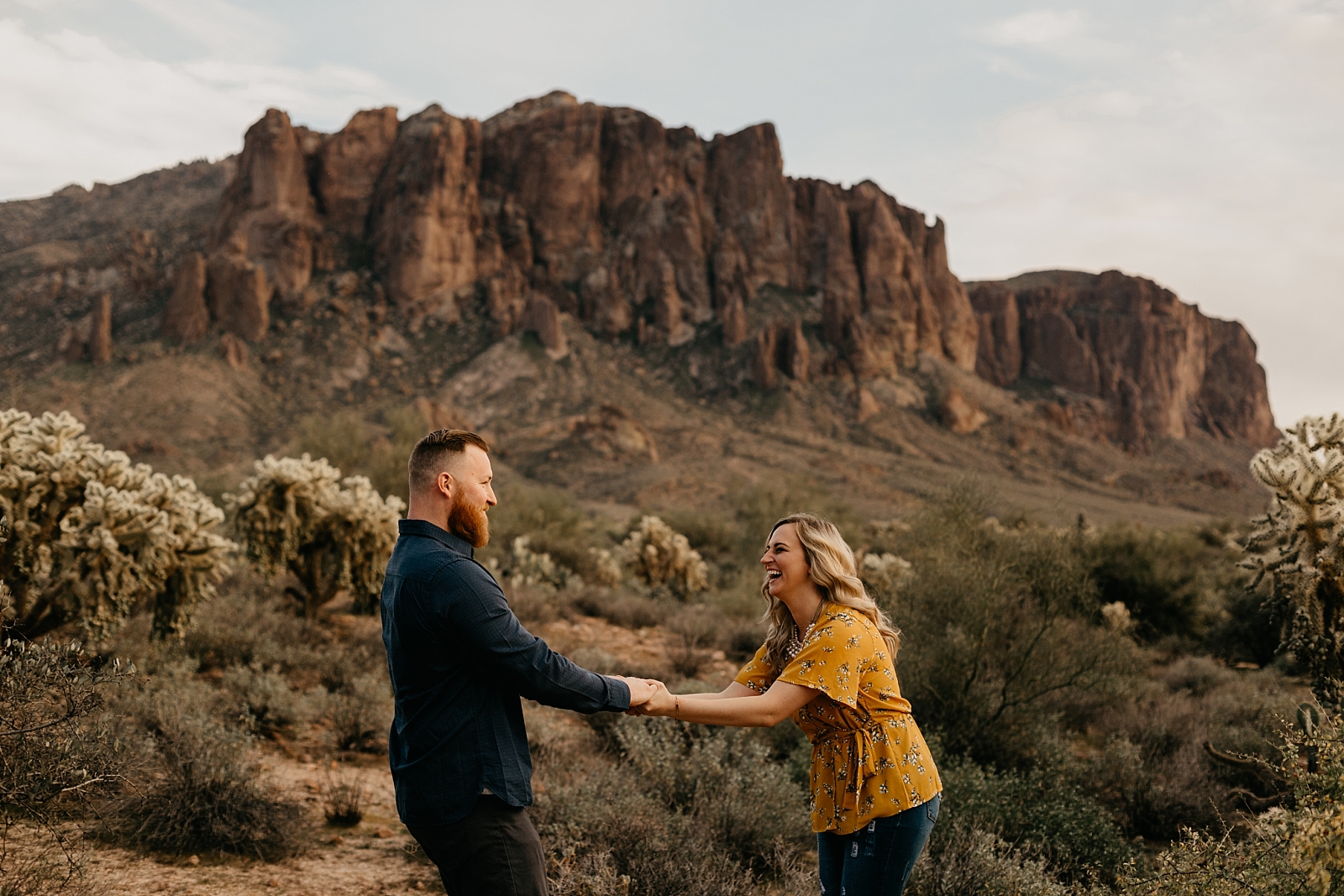 couple dancing and laughing fun in the desert lost dutchman superstition mountain engagement photos apache junction az samantha patri photography