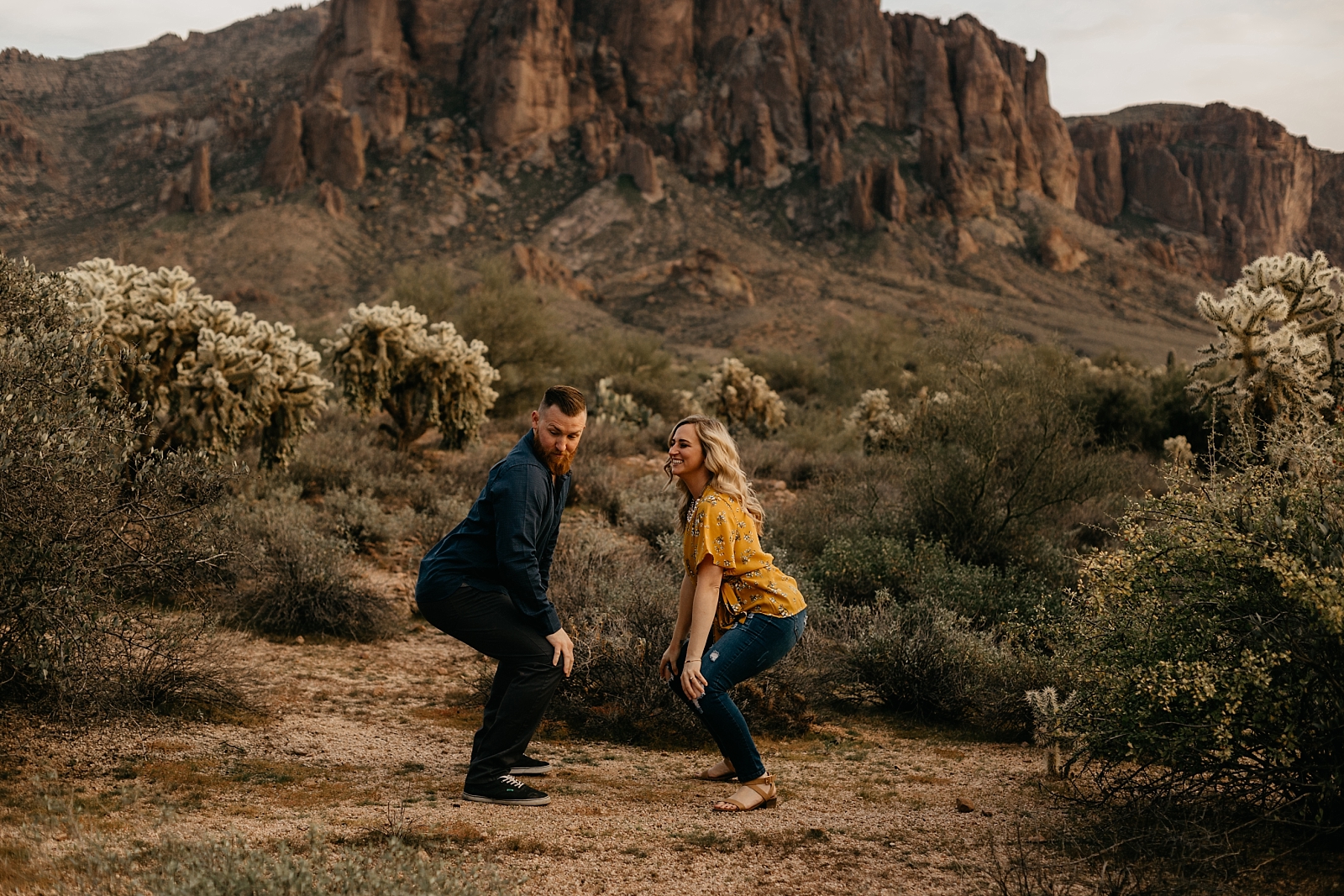 couple dancing and laughing fun tina twerk in the desert lost dutchman superstition mountain engagement photos apache junction az samantha patri photography