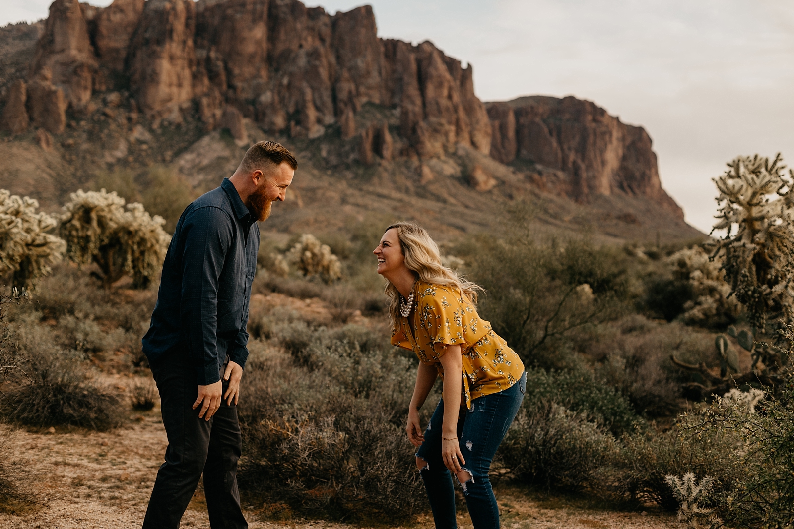 couple dancing and laughng fun in the desert lost dutchman superstition mountain engagement photos apache junction az samantha patri photography