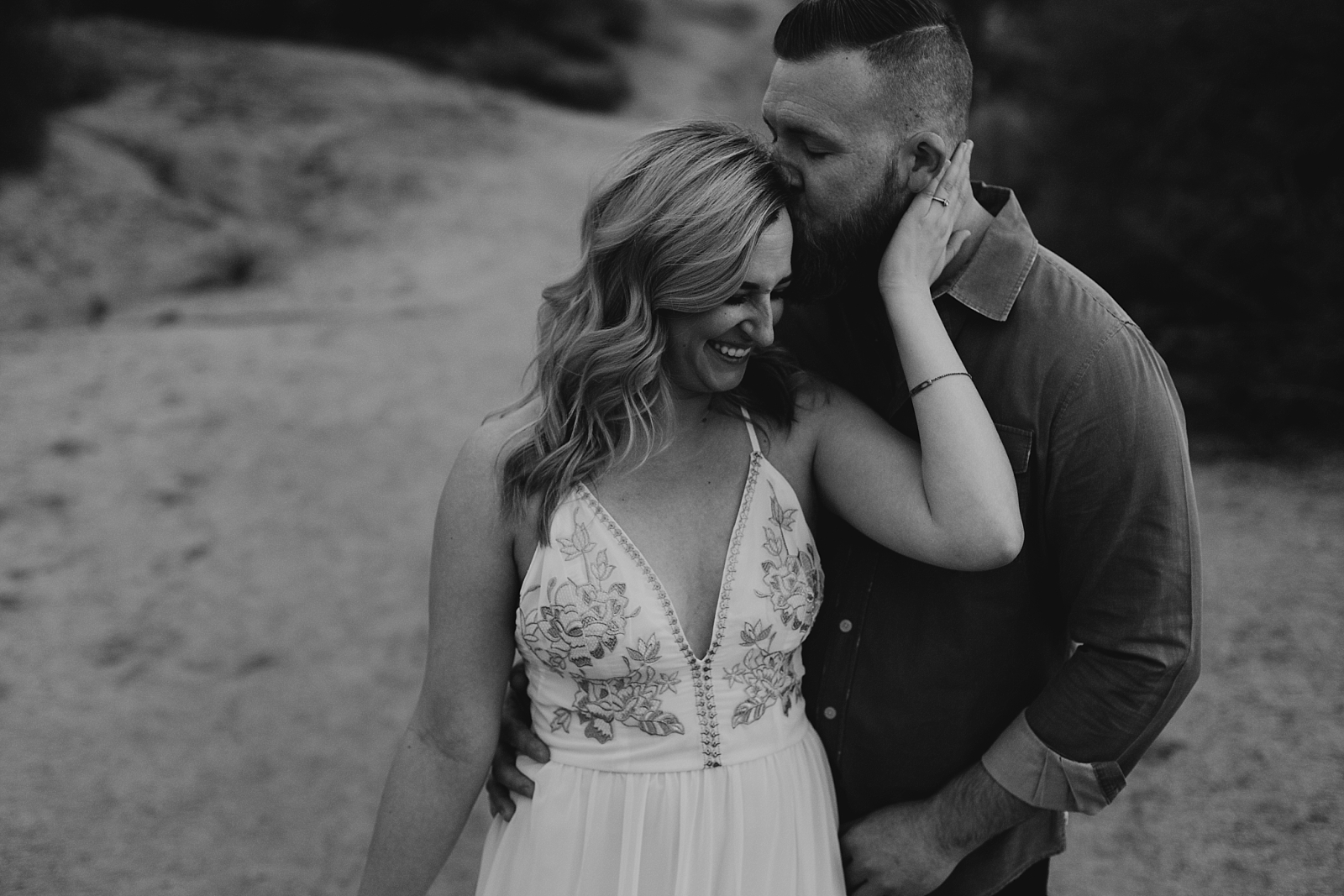 couple cuddling and laughing engagement pictures apache junction az samantha patri photography