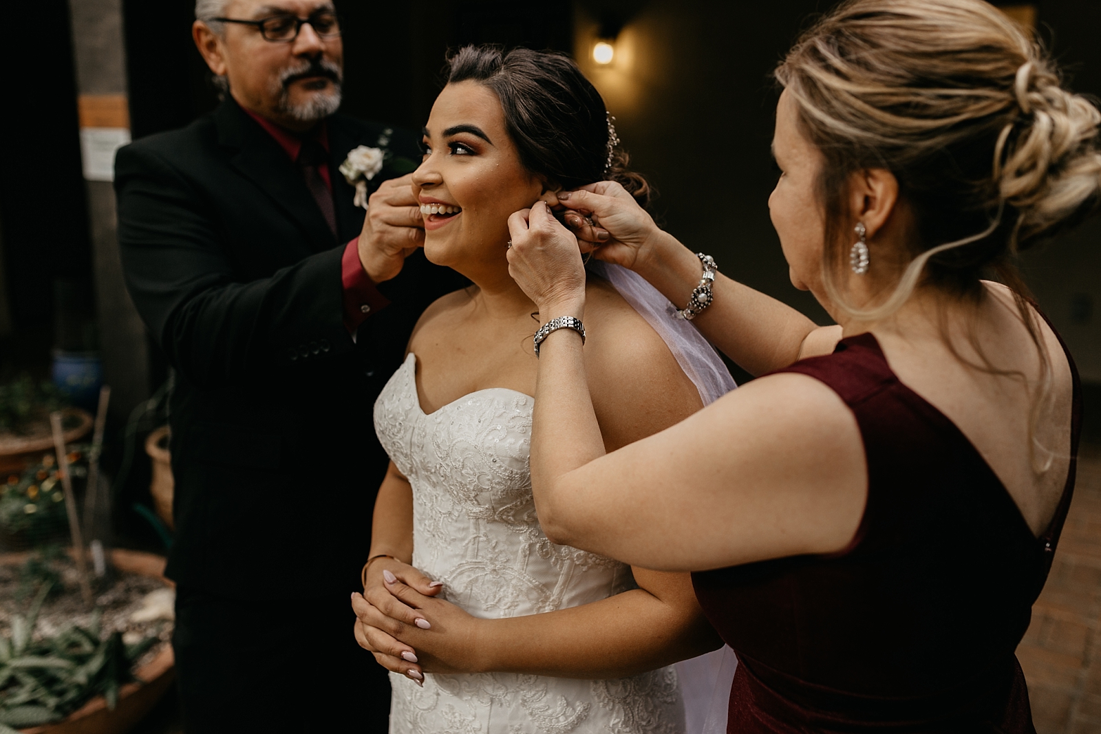 Bride getting ready with her mom and dad Tucson Arizona wedding photographer