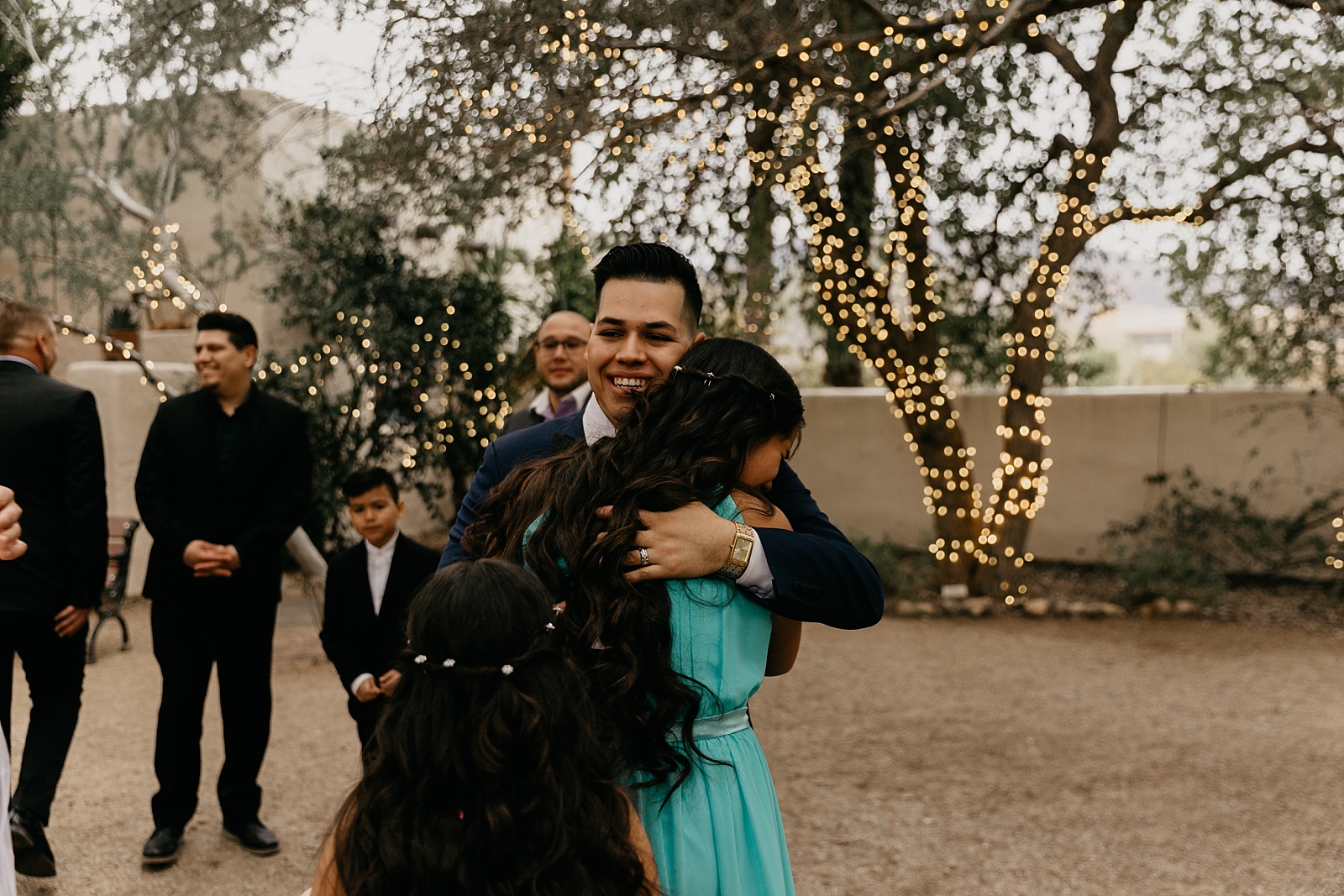 Candid family hugs Tohono Chul Wedding photos Tucson AZ Photographer