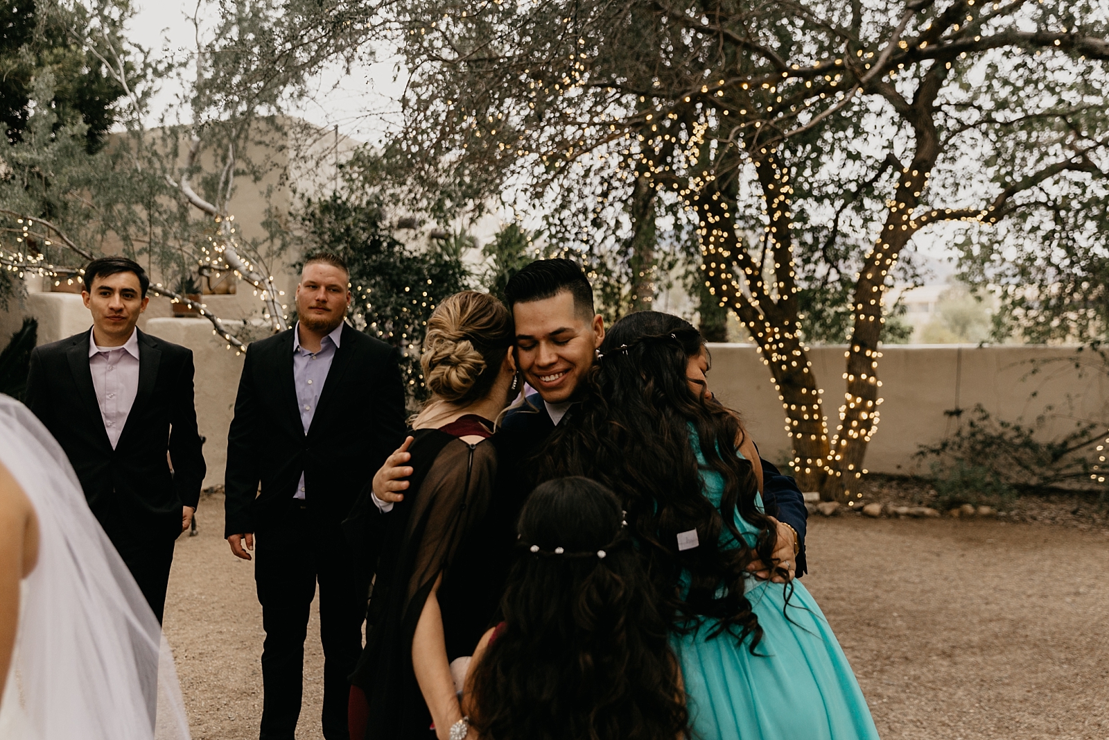 Candid family hugs Tohono Chul Wedding photos Tucson AZ Photographer