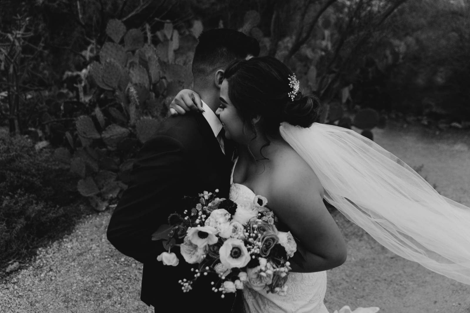 Black and white Desert Bride and groom pictures with flying veil Tucson Wedding Photographer Samantha Patri Photography