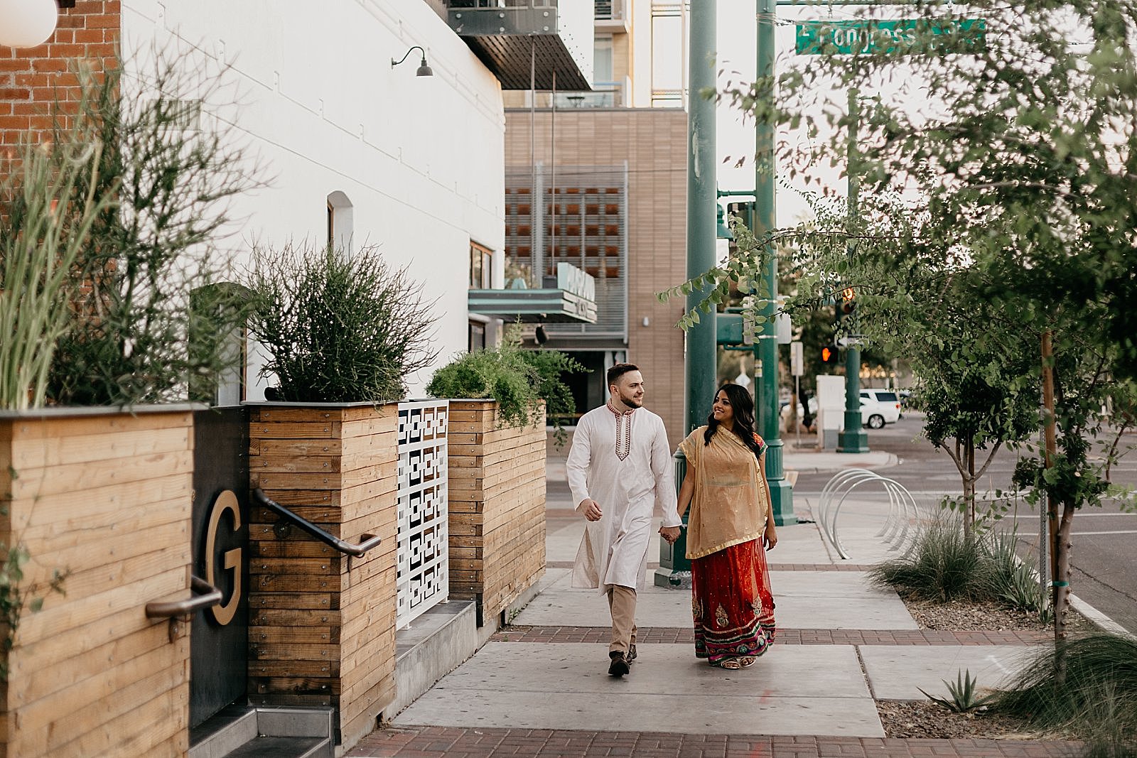 Sunrise downtown tucson AZ engagement photos Indian couple outside hotel congress