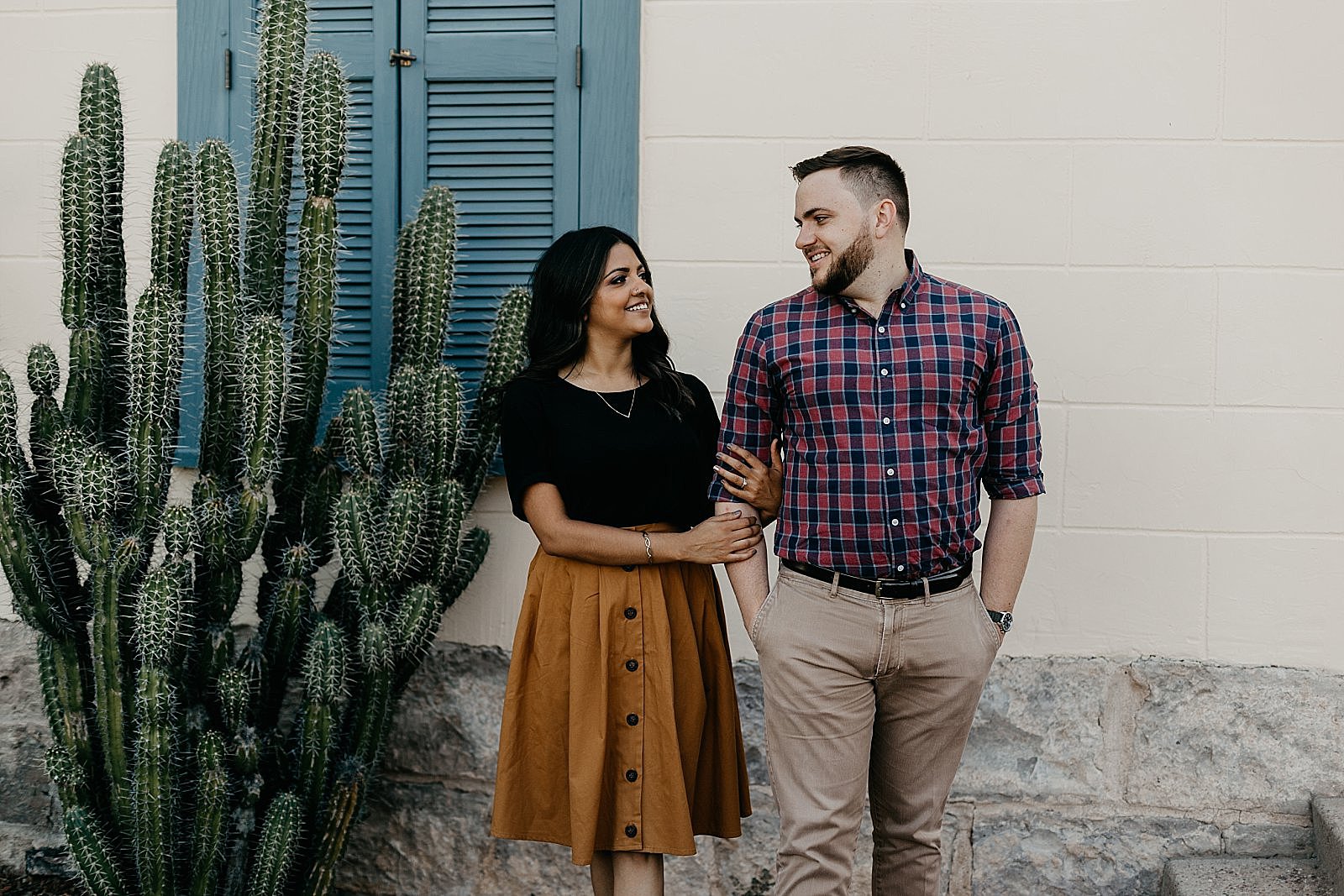 Downtown Tucson arizona engagement photos with colorful adobe architecture