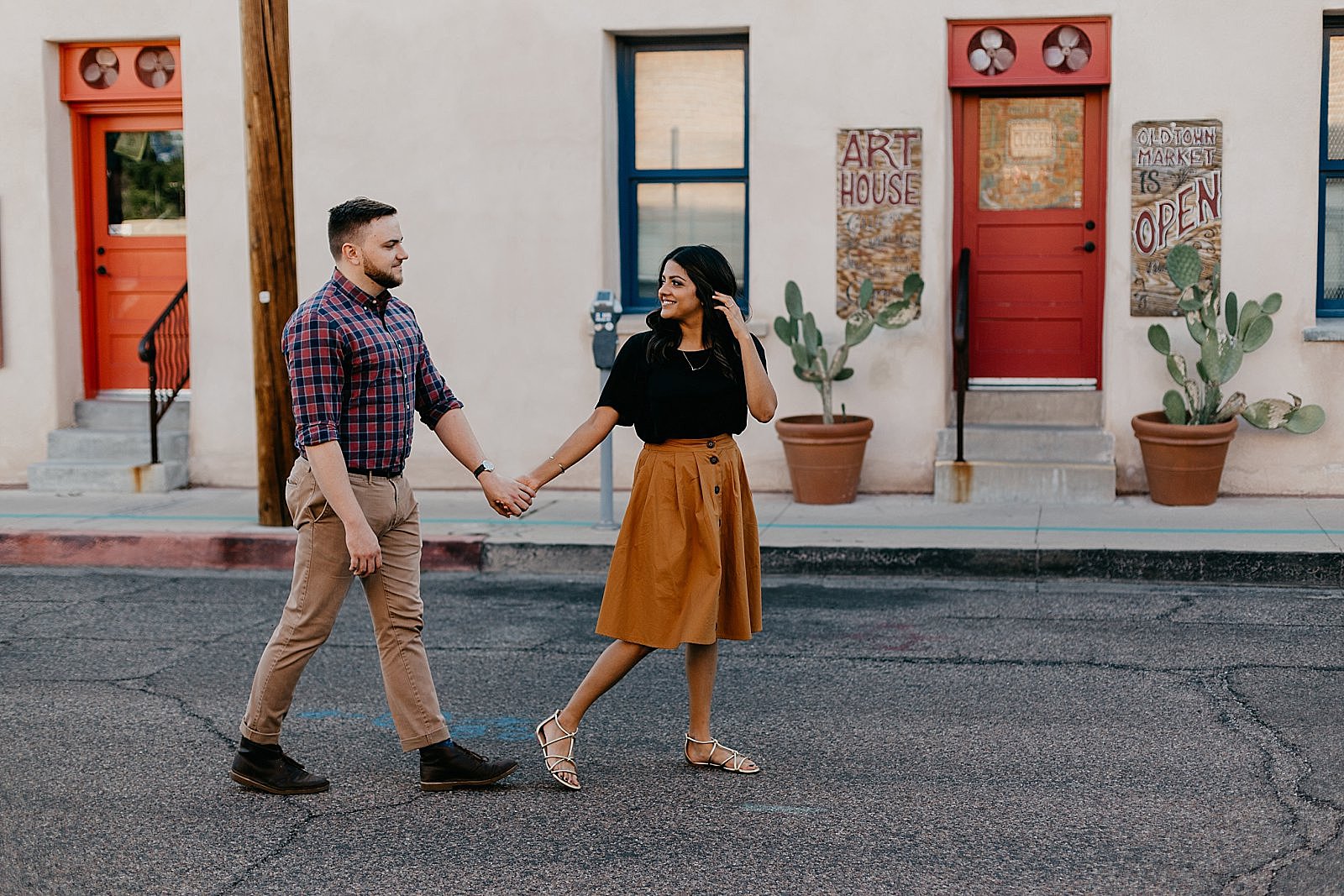 Downtown Tucson arizona engagement photos with colorful adobe architecture