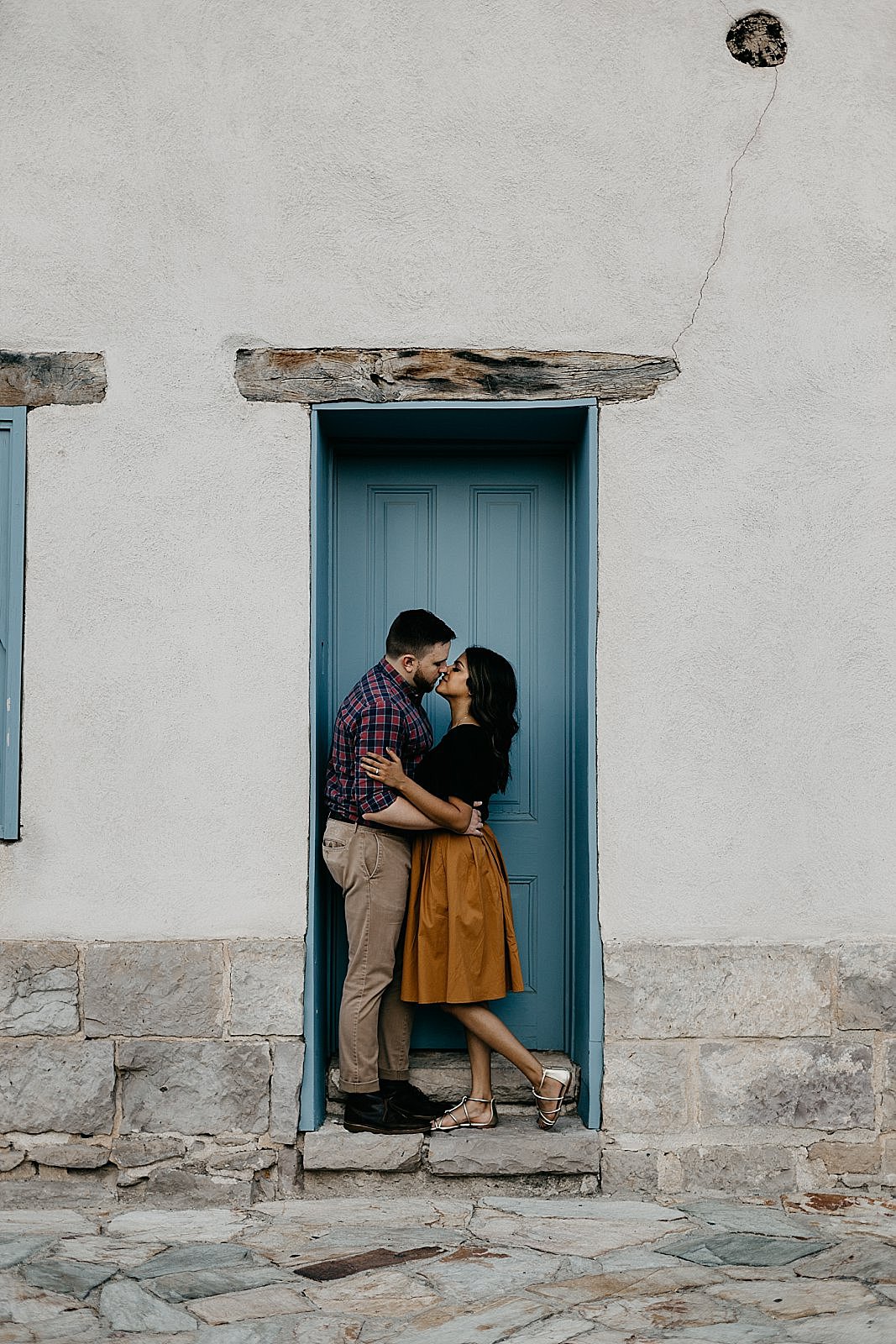 couple in colorful adobe doorway in tucson