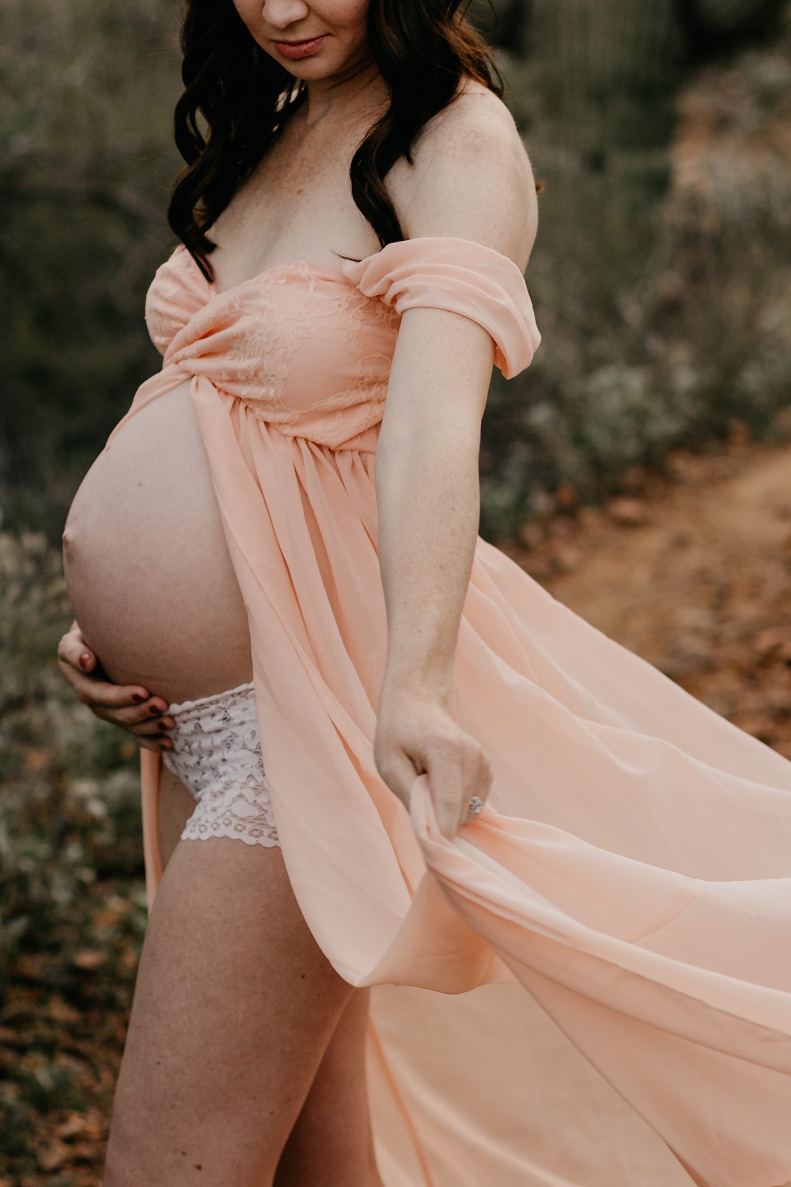 Maternity photo dramatic pink dress swishing