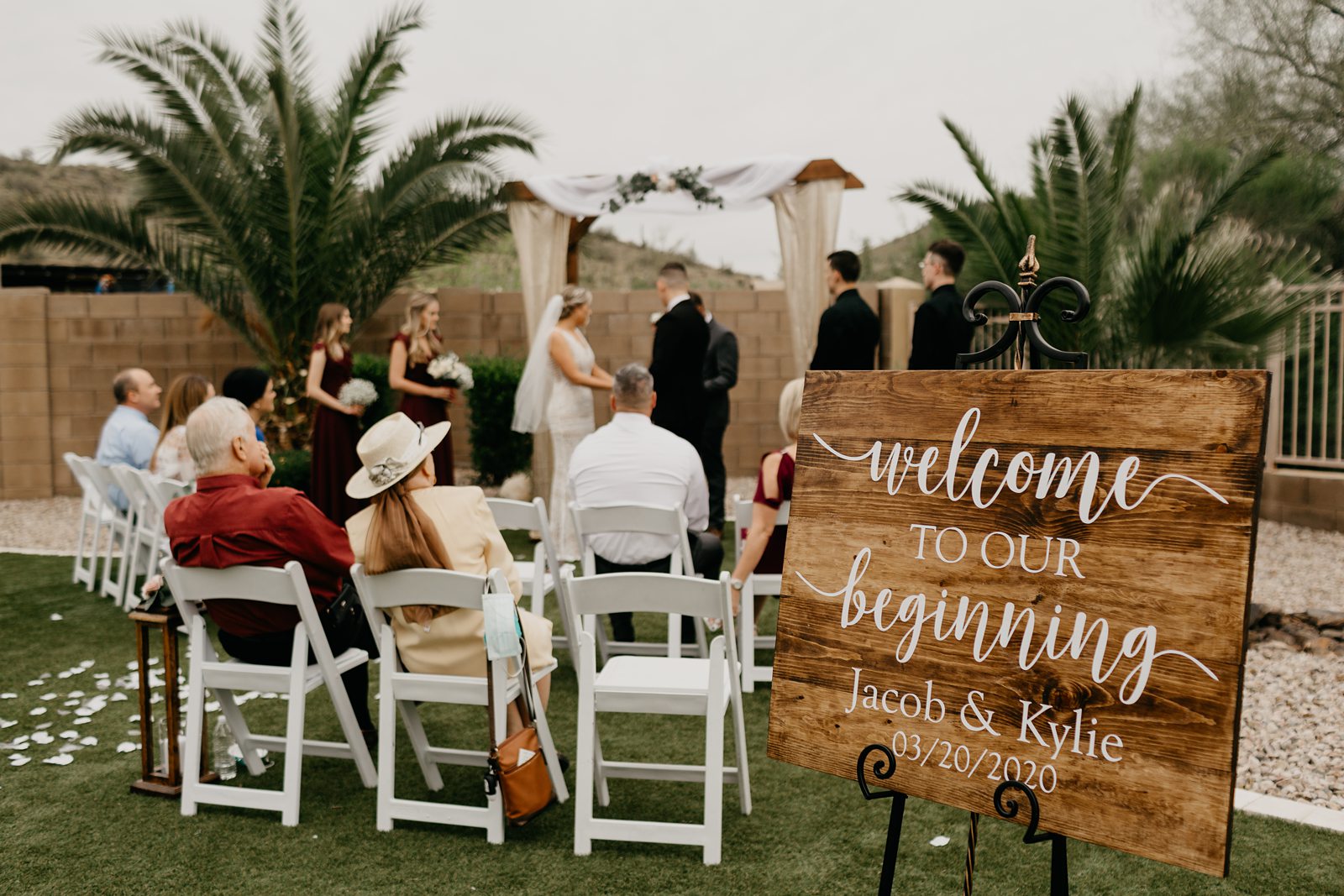 A bride and groom during their ceremony during their backyard elopement in Glendale Az