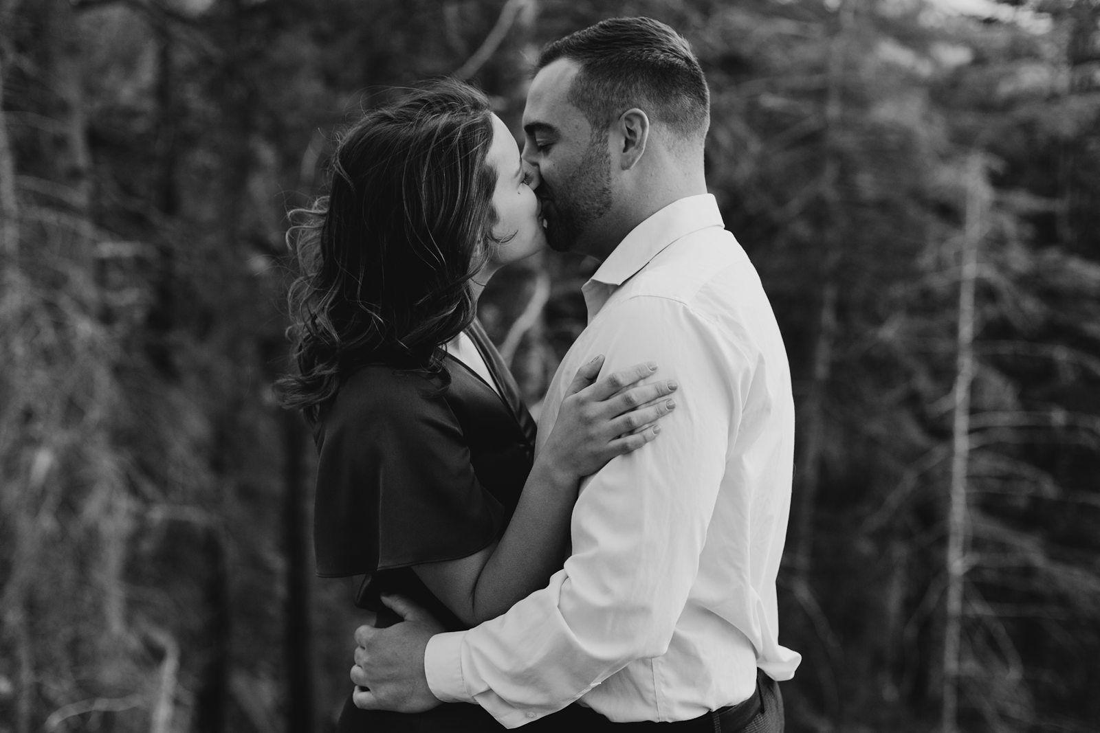 Arizona mountain top engagement black-and-white photo of couple kissing