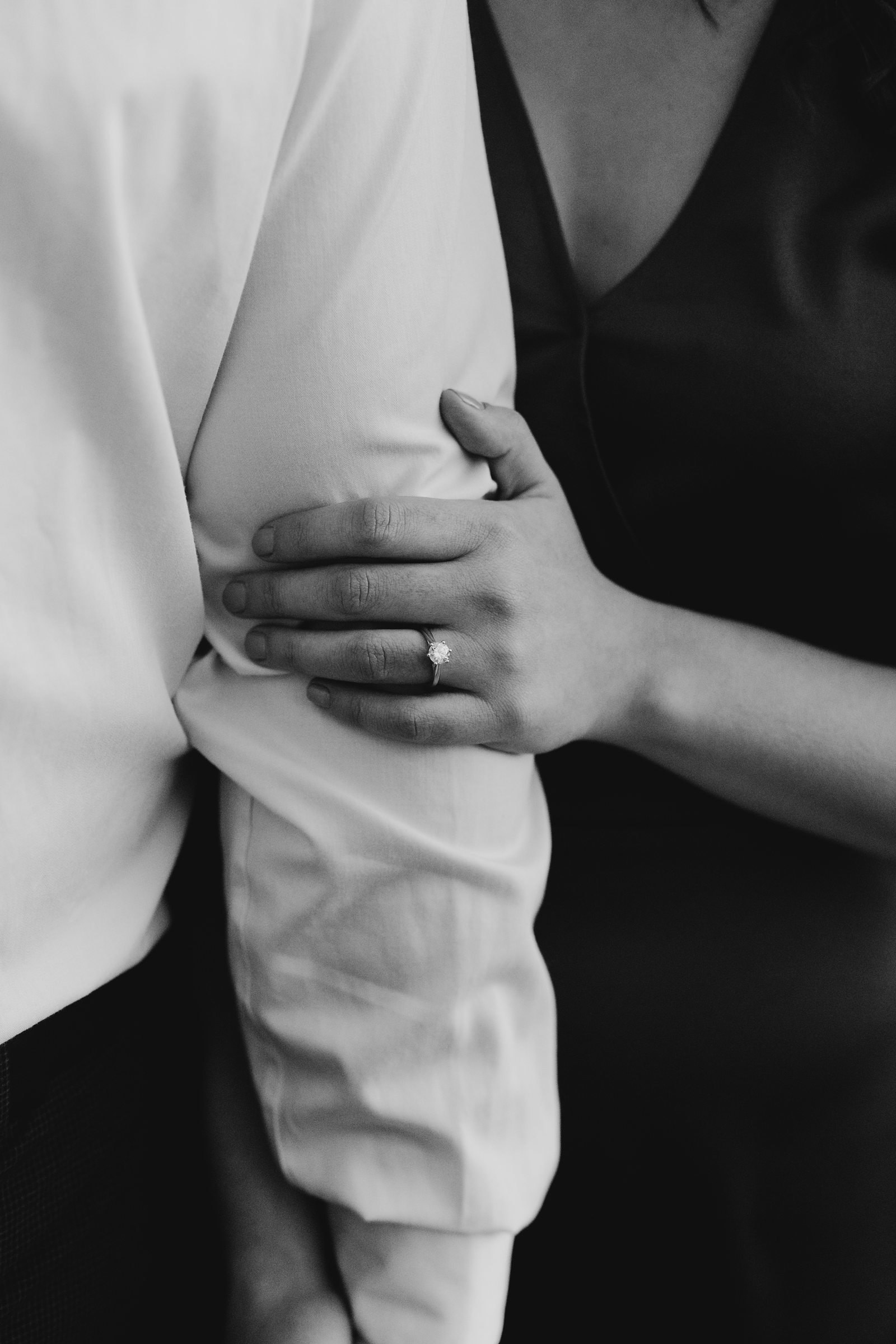 Engagement ring and hands photo, black, and white