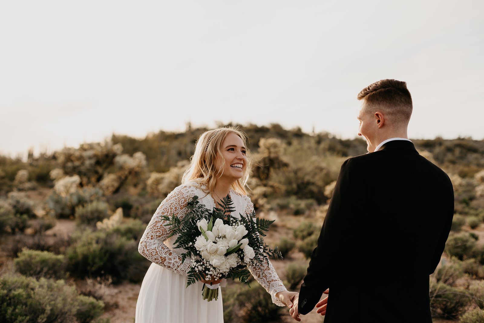 bride and groom frist look during their desert elopement photos in phoenix arizona