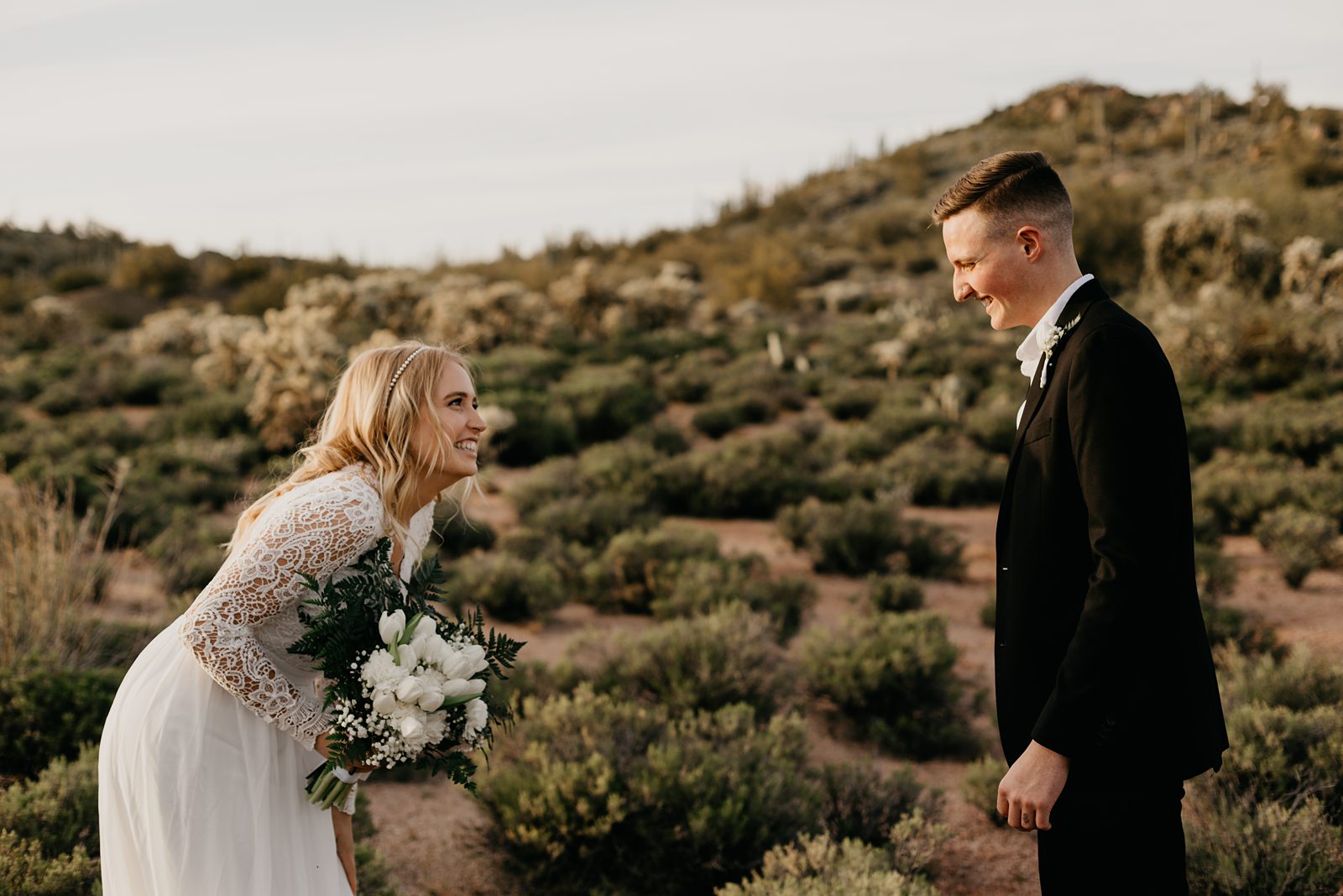 bride and groom frist look during their desert elopement photos in phoenix arizona