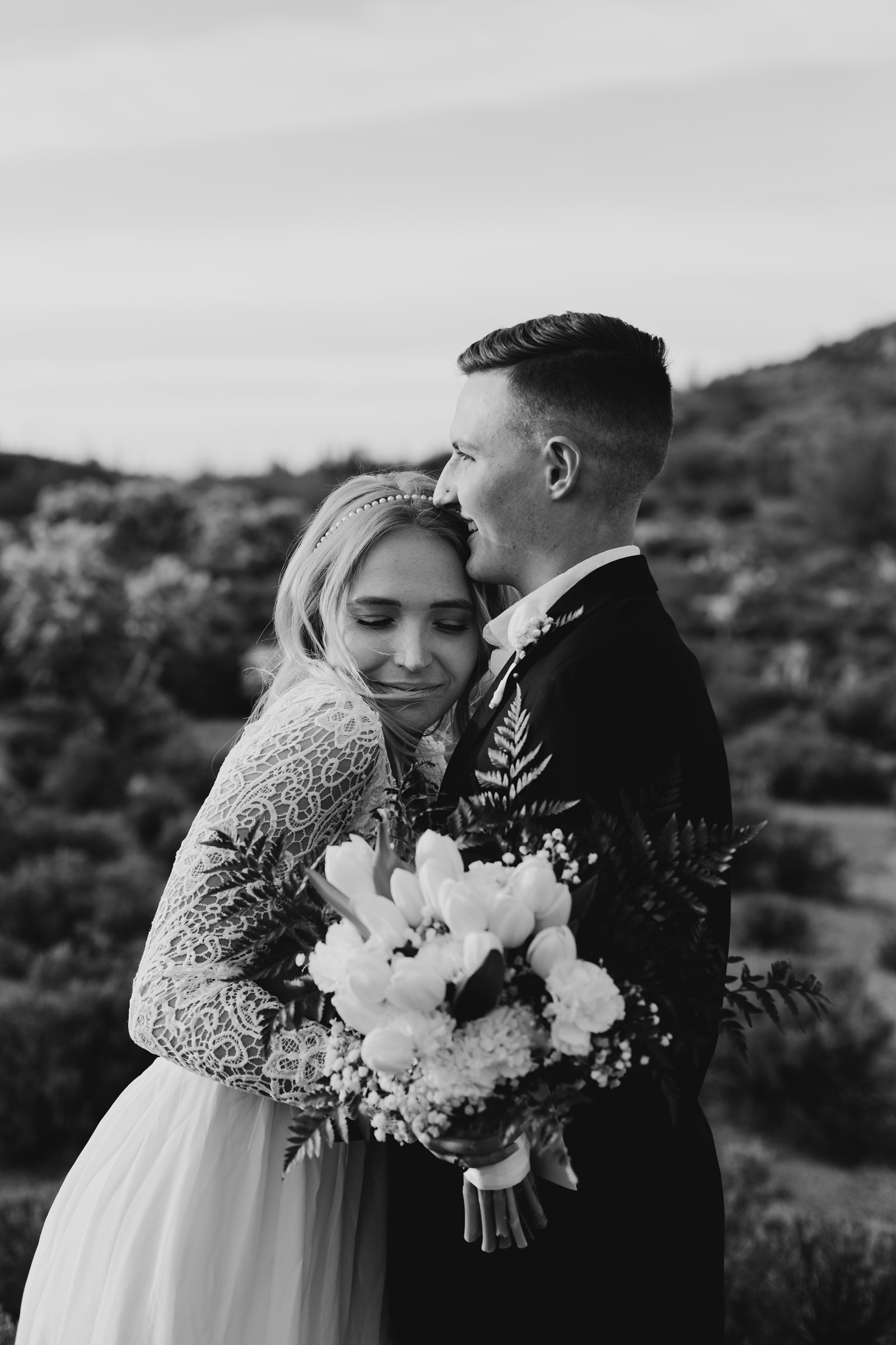 black and white photo of bride and groom frist look during their desert elopement in phoenix arizona