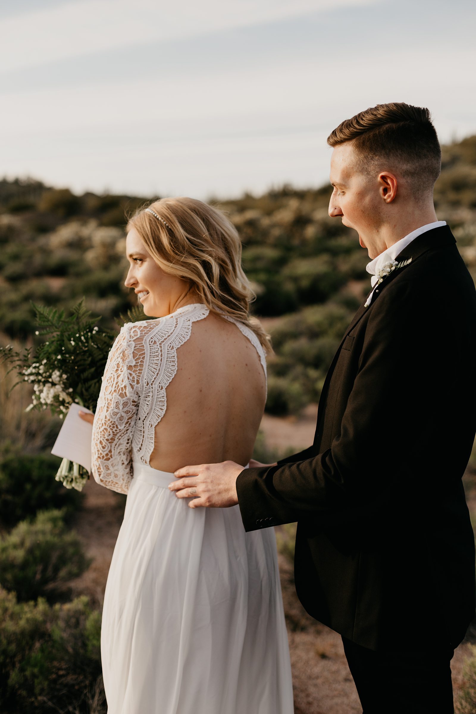 bride and groom frist look during their desert elopement photos in phoenix arizona