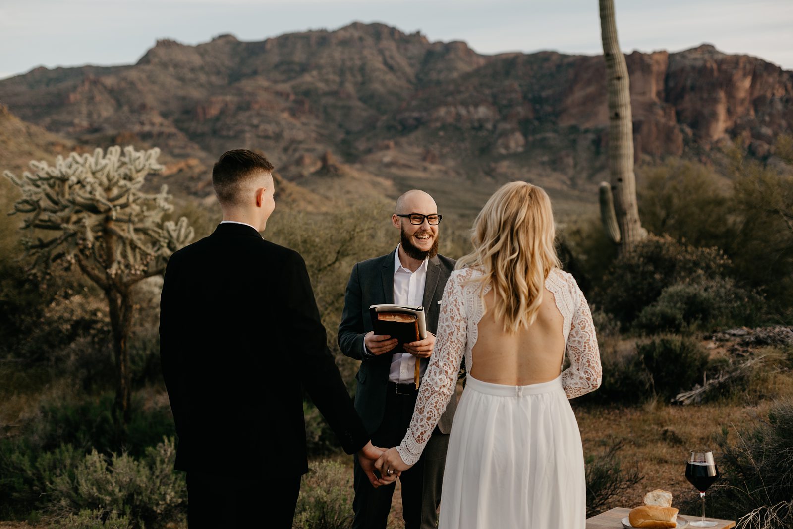 superstition mountain intimate elopement in the phoenix arizona desert bride with boho open back lace dress