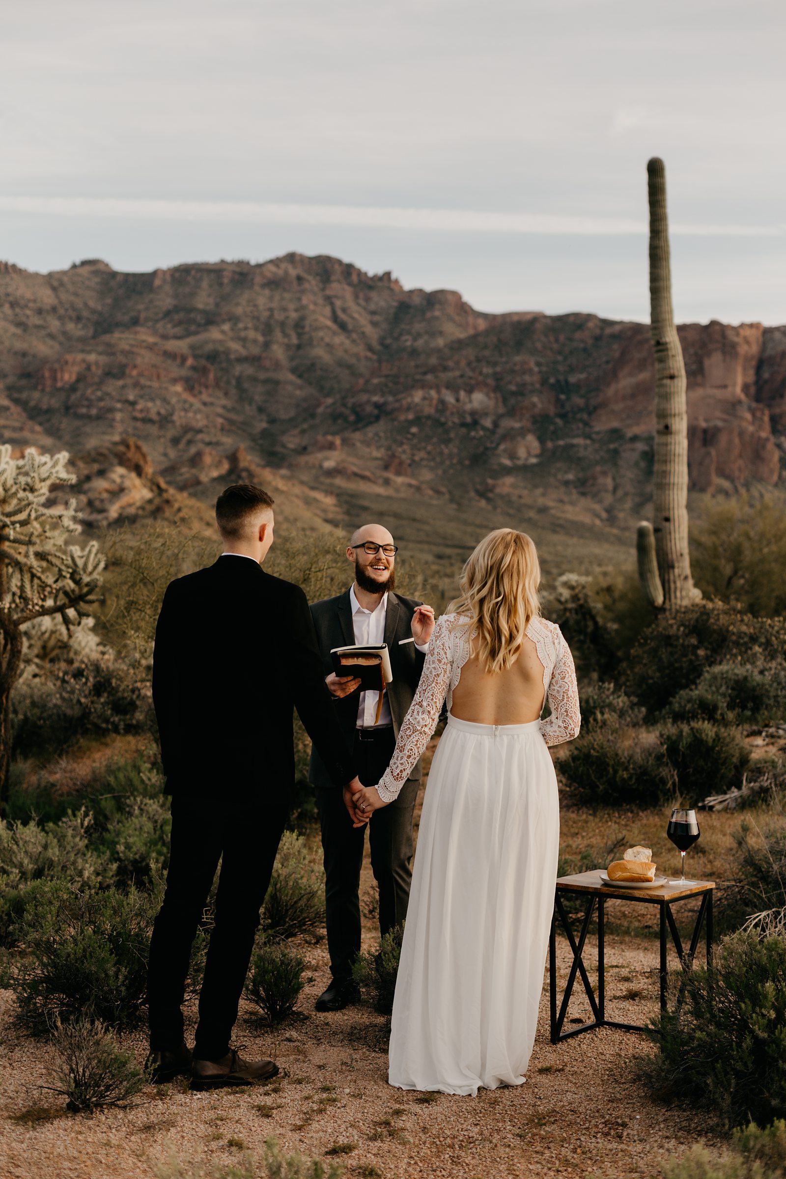 superstition mountain intimate elopement in the phoenix arizona desert bride with boho open back lace dress