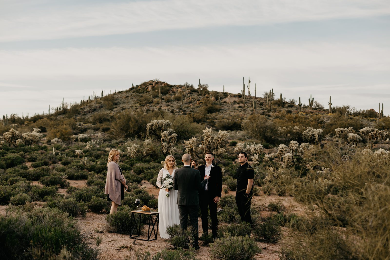 mountainside intimate elopement in the phoenix arizona desert bride with boho open back lace dress