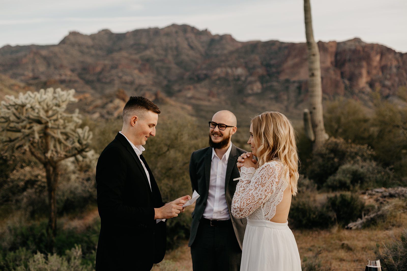 bride and groom exchanging vows in the superstition mountains for their adventurous intimate wedding in the phoenix arizona desert