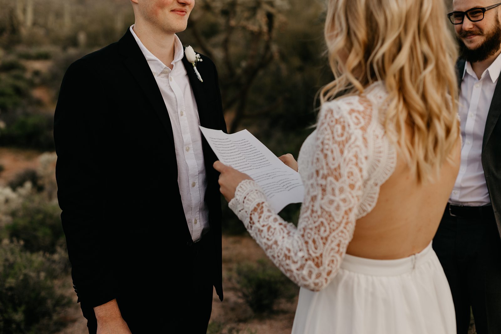 bride and groom exchanging vows in the superstition mountains for their adventurous intimate wedding in the phoenix arizona desert