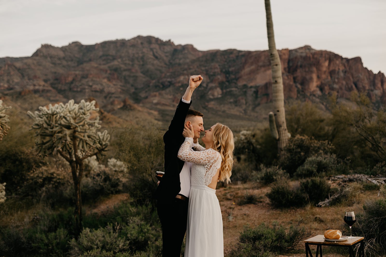 bride and groom kissing celebrating after ceremony wedding at superstition mountain intimate elopement phoenix AZ