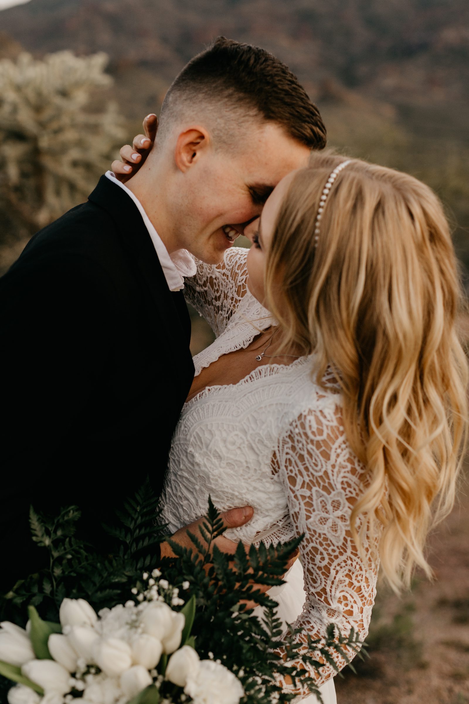 close up photo of bride and groom smiling close together