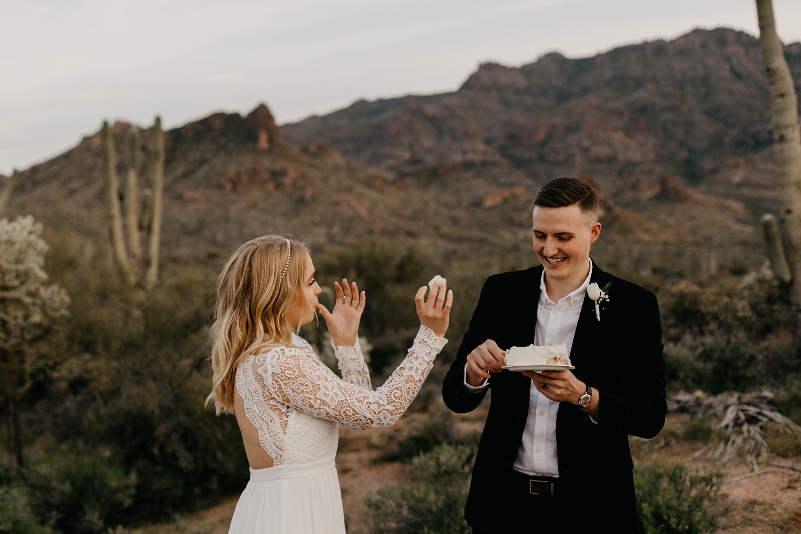 Wedding couple cake cutting in the desert for superstition mountain intimate elopement phoenix az