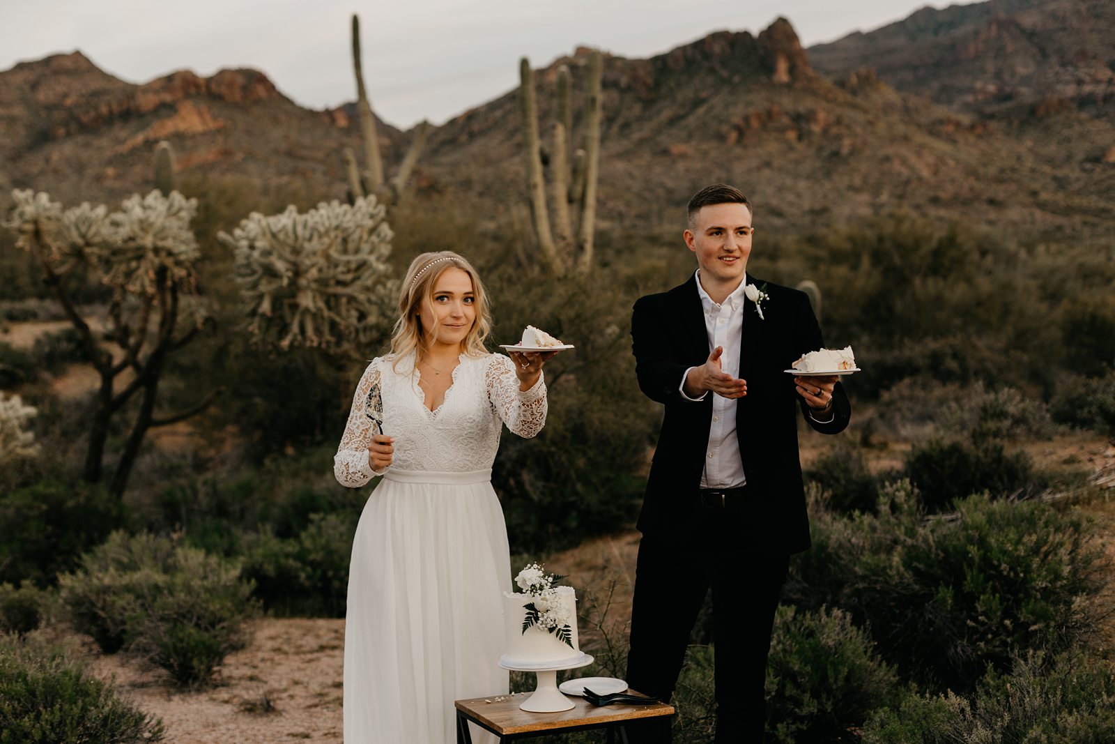 Wedding couple cake cutting in the desert for superstition mountain intimate elopement phoenix arizona