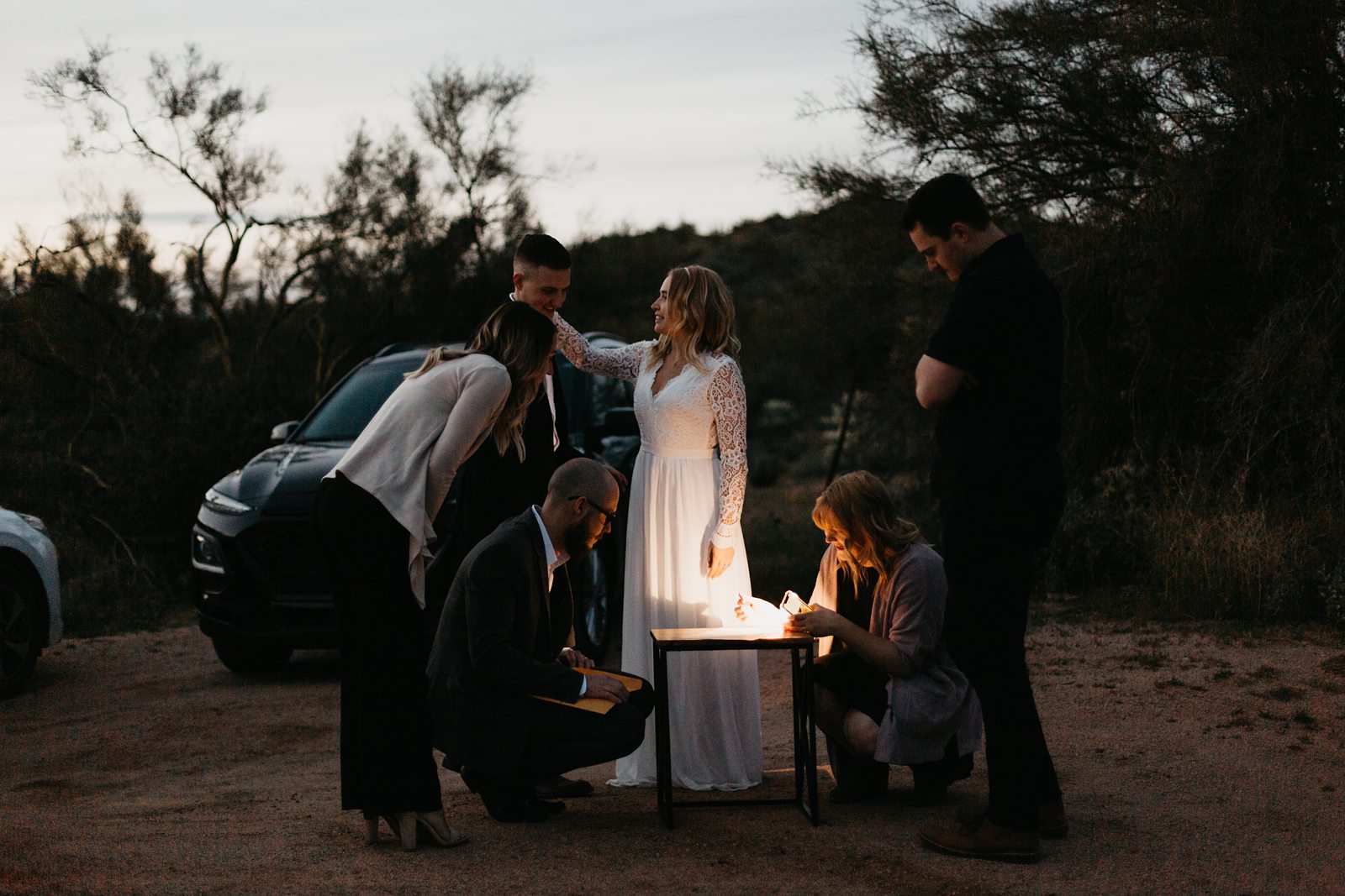 intimate wedding license signing by flashlight in the desert of arizona