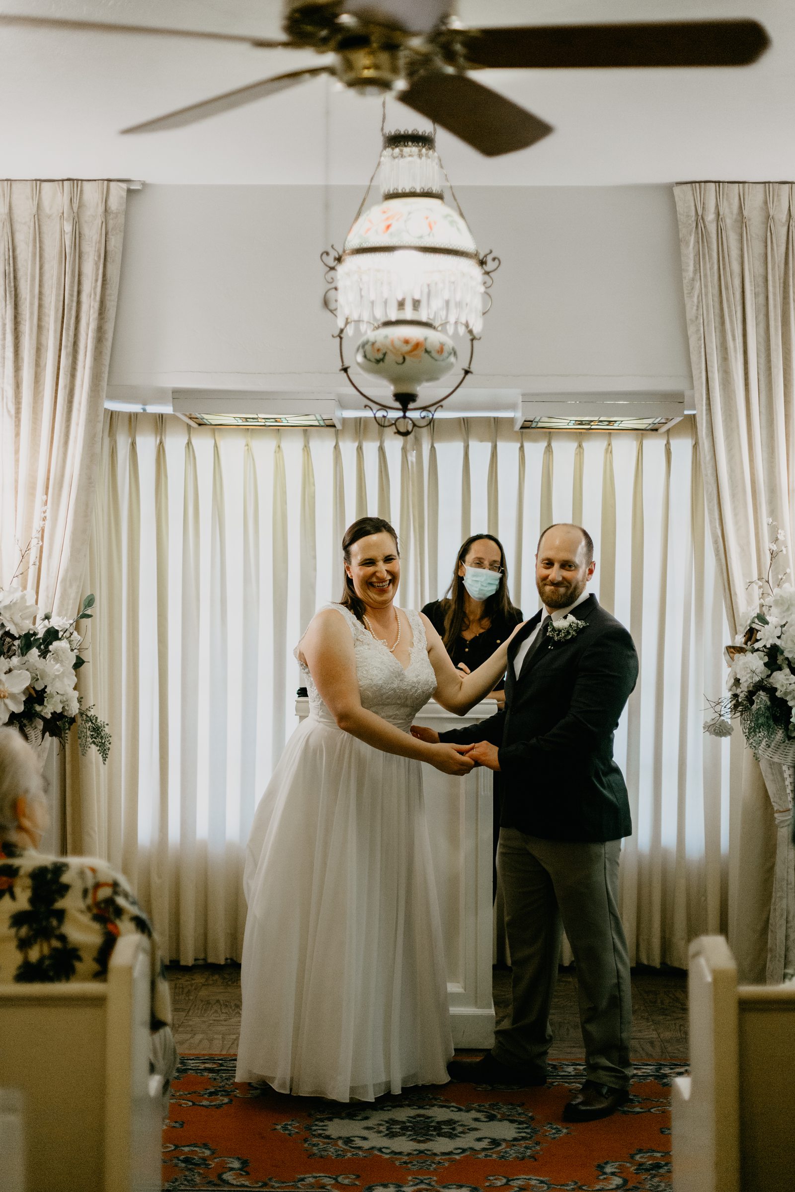 happy couple during ceremony ceremony ring exchange Arizona Yuma elopement photos of ceremony at Lutes Gretna Green wedding chapel