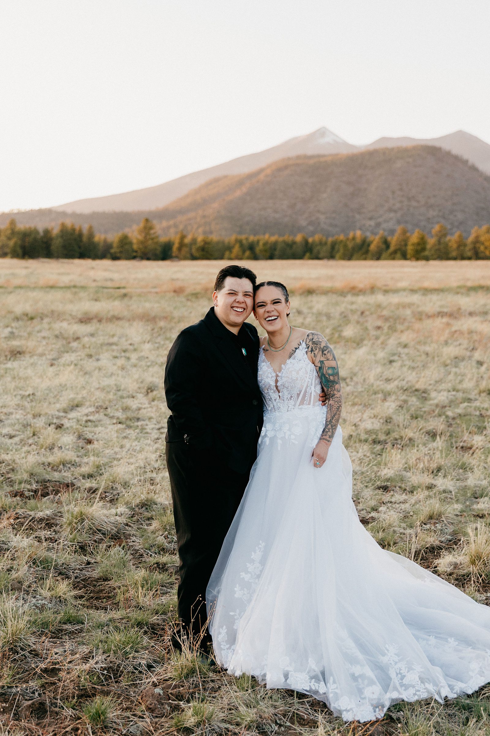 intimate wedding couple looking at the camera