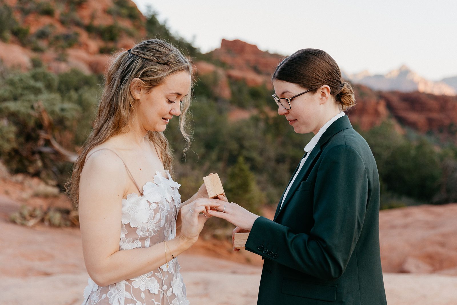 Brides exchanging rings during a lopement ceremony Sedona